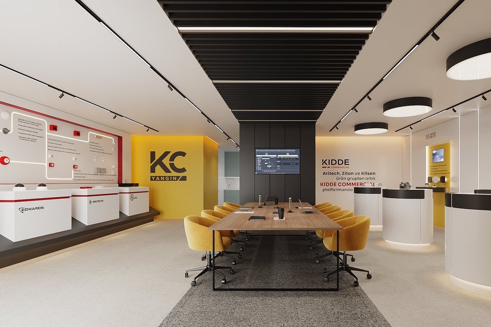 KC Yangın showroomu, toplantı masası ve sarı kurumsal duvar