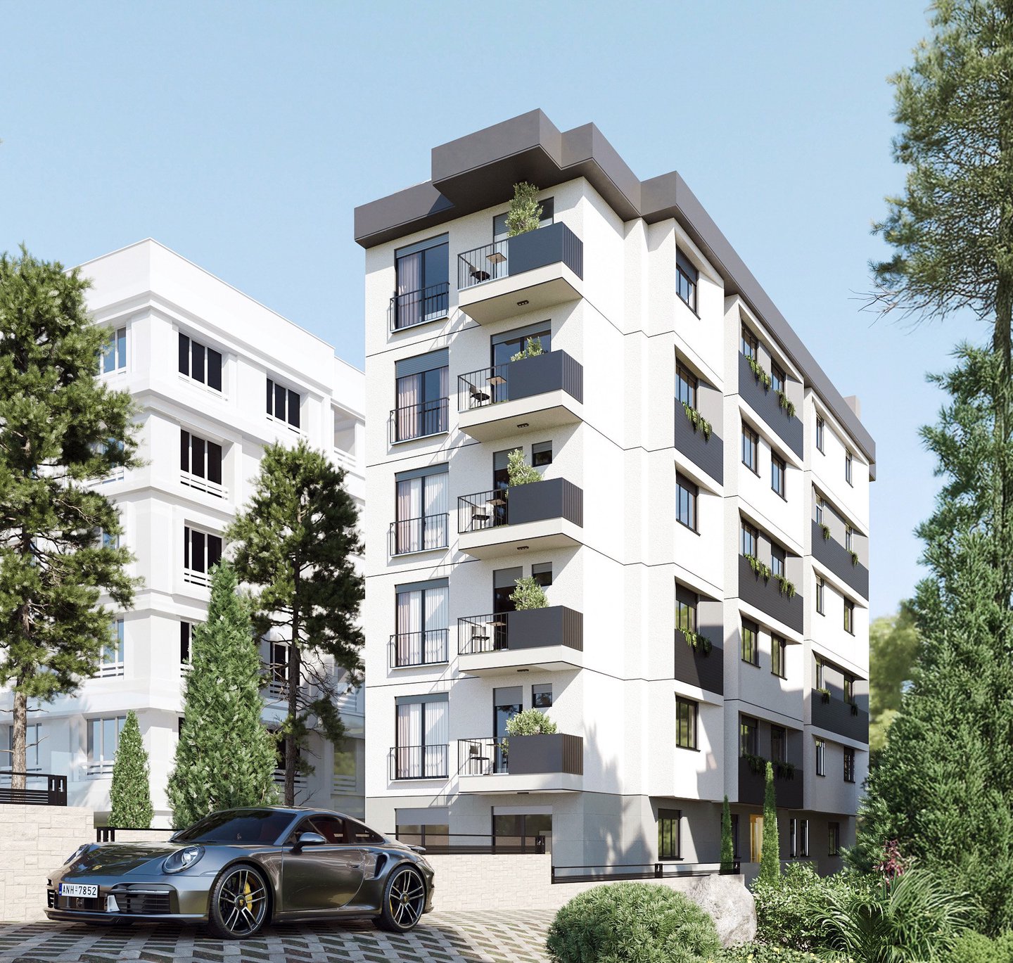 Kordonboyu Apartmanı: beyaz sıvalı, antrasit balkon panelli altı katlı konut yapısının sokaktan görünüşü